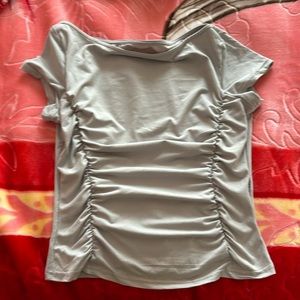 Tight, ruffled on the sides to make a very slim look